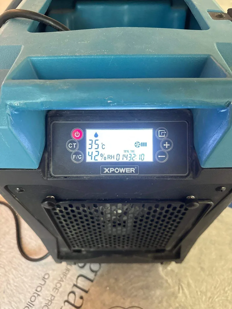 A dehumidifier readout logged during drying